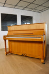 Piano acoustique Legnica 116 d'occasion en finition bois clair
