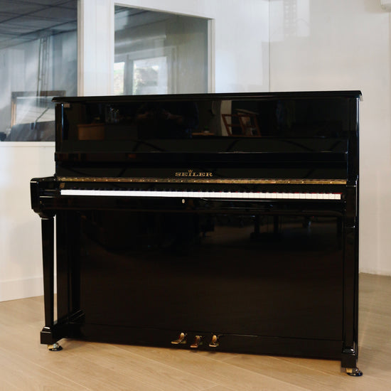 Seiler 116 piano droit d'occasion noir brillant