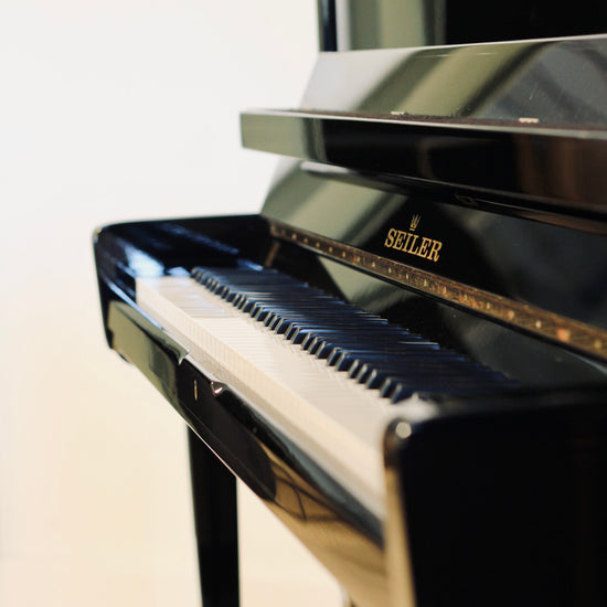 Seiler 116 piano droit d'occasion de fabrication allemande